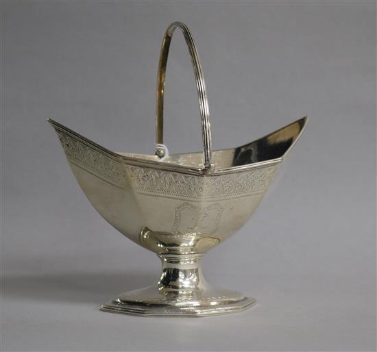 A George III silver panelled boat shaped pedestal sugar basket, London, 1787, length 15.6cm.